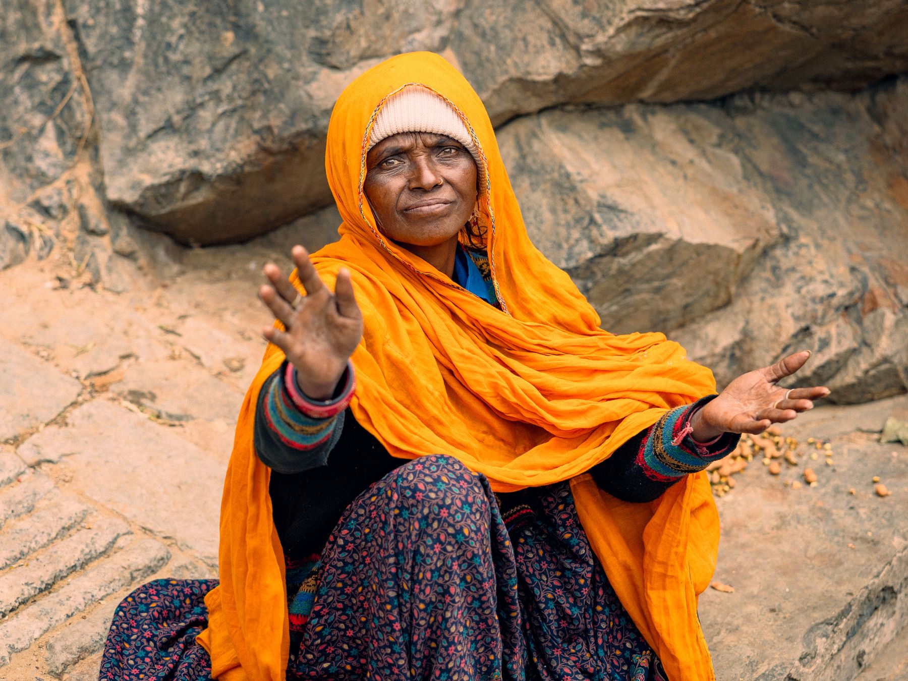 Sassy Woman Begging In Orange Shawl Portrait
